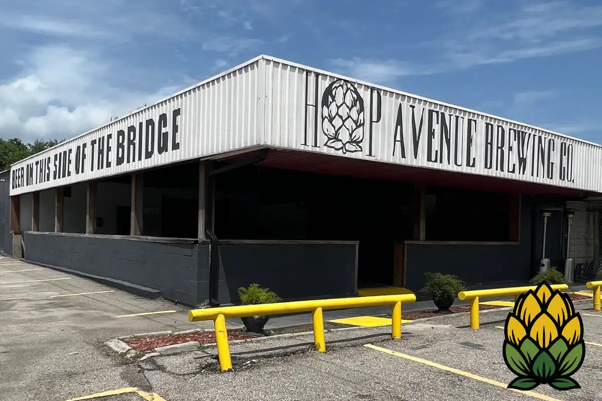 Exterior of Hop Avenue Brew Pub in Bridge City featuring industrial building signage and a hop flower logo