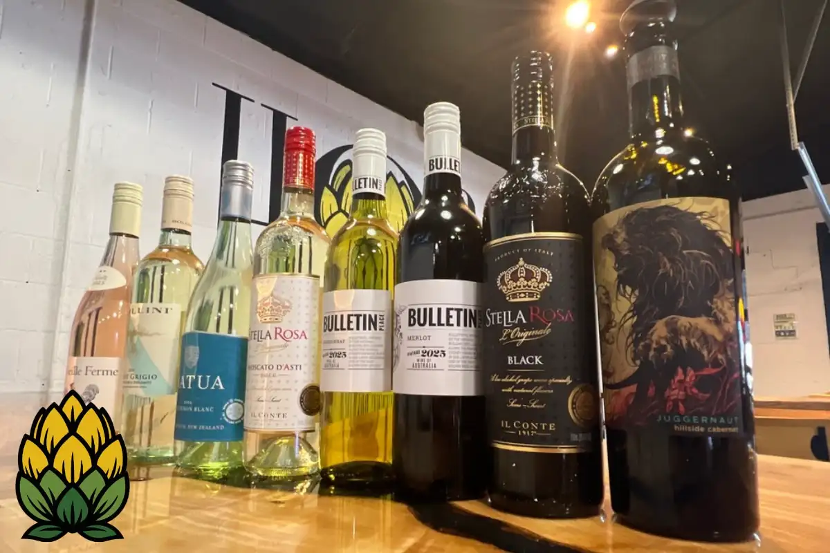 "A premium lineup of red, white, and rosé wine bottles at Hop Avenue Brew Pub in Bridge City."
